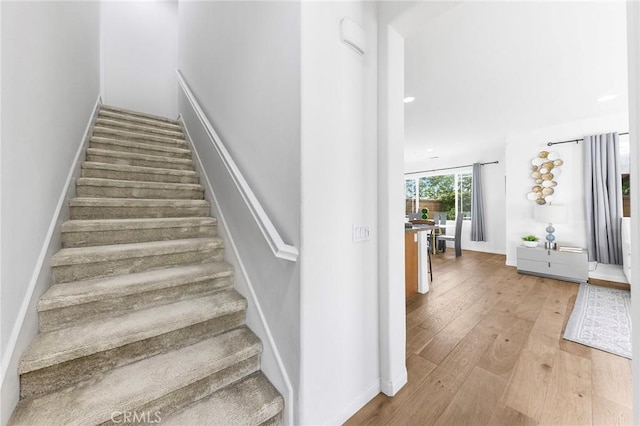 6410 Eucalyptus Ave, Chino, CA 91710 - staircase with wood-type flooring and baseboards