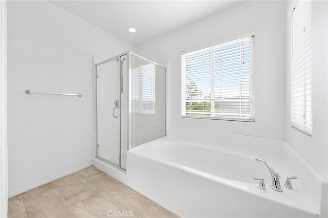 6410 Eucalyptus Ave, Chino, CA 91710 - full bathroom with a garden tub, baseboards, and a stall shower