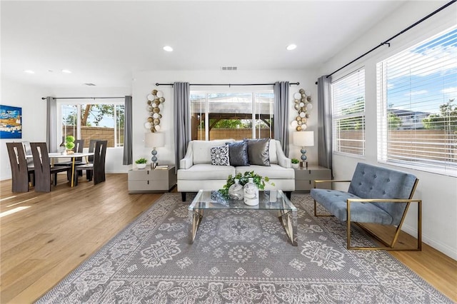 6410 Eucalyptus Ave, Chino, CA 91710 - living room featuring recessed lighting, visible vents, and wood finished floors