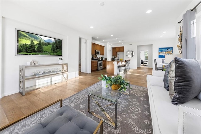 6410 Eucalyptus Ave, Chino, CA 91710 - living area with recessed lighting and light wood finished floors