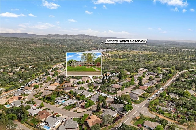birds eye view of property with a residential view and a mountain view