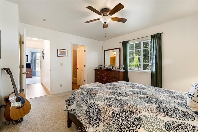 bedroom with carpet floors, ceiling fan, and baseboards