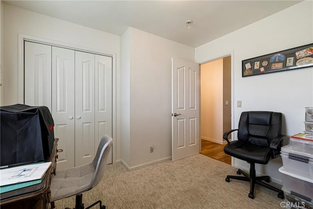 carpeted office with baseboards