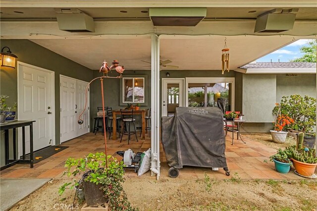 view of patio featuring outdoor dining space and a grill