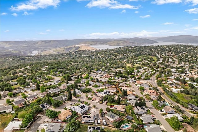 aerial view featuring a residential view and a water and mountain view