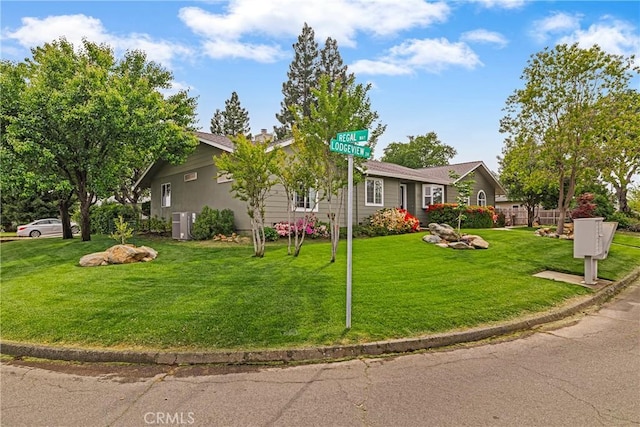 single story home with a front yard