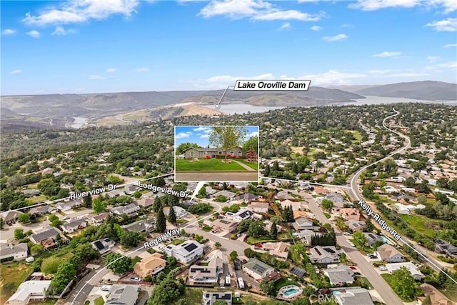 drone / aerial view featuring a residential view and a mountain view
