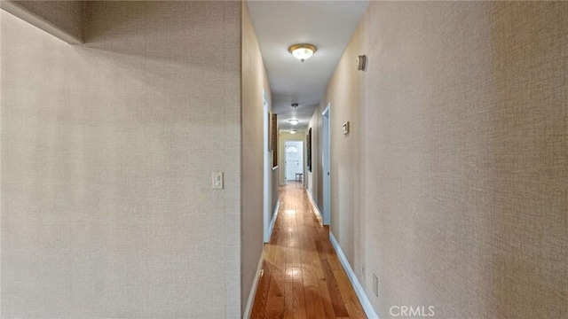 12782 Periwinkle Dr, North Tustin, CA 92705 - hall featuring hardwood / wood-style floors and baseboards