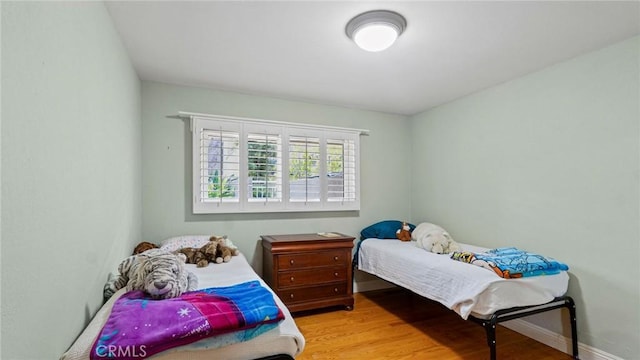 12782 Periwinkle Dr, North Tustin, CA 92705 - bedroom featuring wood finished floors and baseboards
