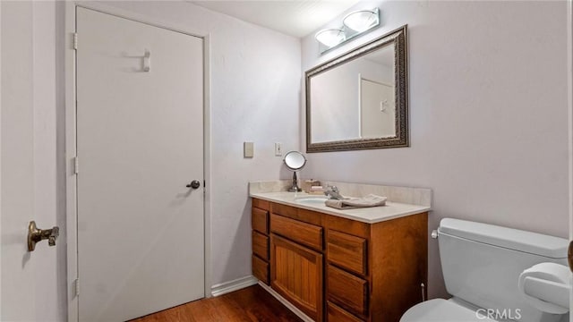 12782 Periwinkle Dr, North Tustin, CA 92705 - bathroom featuring vanity, toilet, and wood finished floors