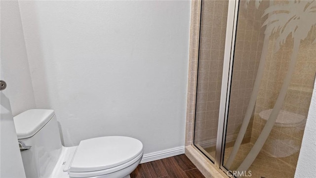 12782 Periwinkle Dr, North Tustin, CA 92705 - full bathroom with toilet, a stall shower, wood finished floors, and baseboards