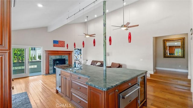 12782 Periwinkle Dr, North Tustin, CA 92705 - kitchen featuring a sink, a warming drawer, ceiling fan, light wood-style floors, and open floor plan