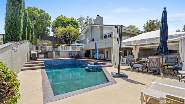 12782 Periwinkle Dr, North Tustin, CA 92705 - view of pool featuring a patio area, a pool with connected hot tub, and outdoor dining space