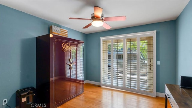 12782 Periwinkle Dr, North Tustin, CA 92705 - doorway to outside featuring ceiling fan, light wood-style floors, and baseboards