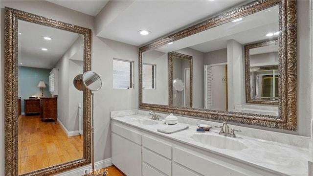 12782 Periwinkle Dr, North Tustin, CA 92705 - full bath featuring wood finished floors, double vanity, baseboards, and recessed lighting