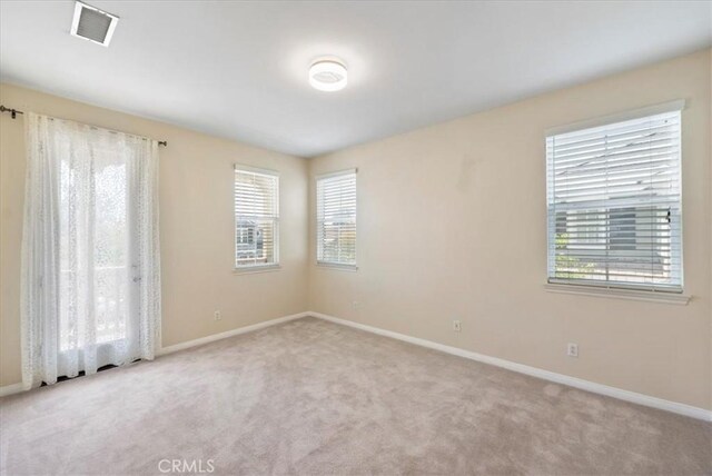 27020 Island Rd, Valencia, CA 91355 - carpeted empty room featuring plenty of natural light