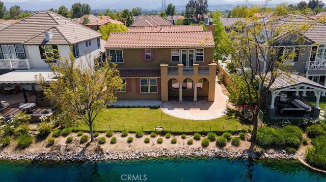 27020 Island Rd, Valencia, CA 91355 - rear view of house featuring a patio, stucco siding, a residential view, and a water view