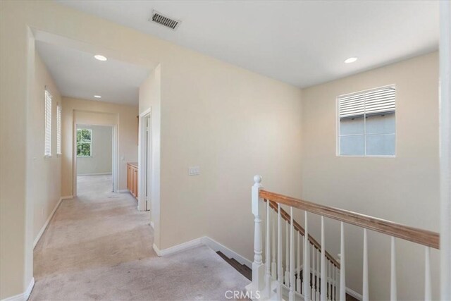 27020 Island Rd, Valencia, CA 91355 - hallway with an upstairs landing, carpet, and recessed lighting