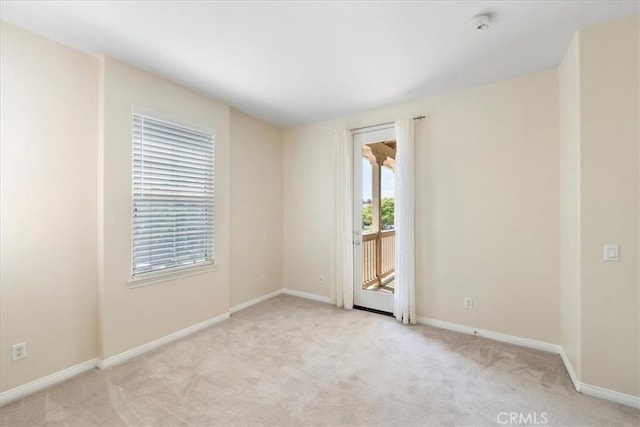 27020 Island Rd, Valencia, CA 91355 - unfurnished room featuring light colored carpet and a smoke detector