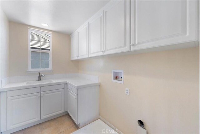 27020 Island Rd, Valencia, CA 91355 - laundry room featuring washer hookup, cabinet space, and light tile patterned flooring