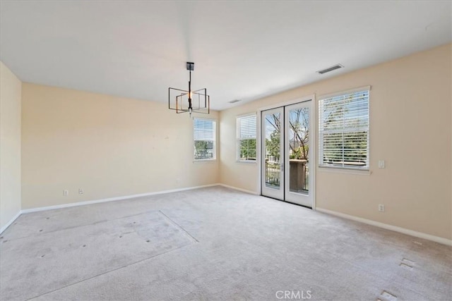 27020 Island Rd, Valencia, CA 91355 - carpeted empty room with baseboards and a chandelier