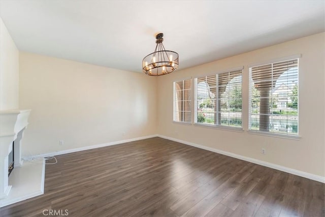 27020 Island Rd, Valencia, CA 91355 - unfurnished living room with healthy amount of natural light, dark wood-style flooring, and a chandelier