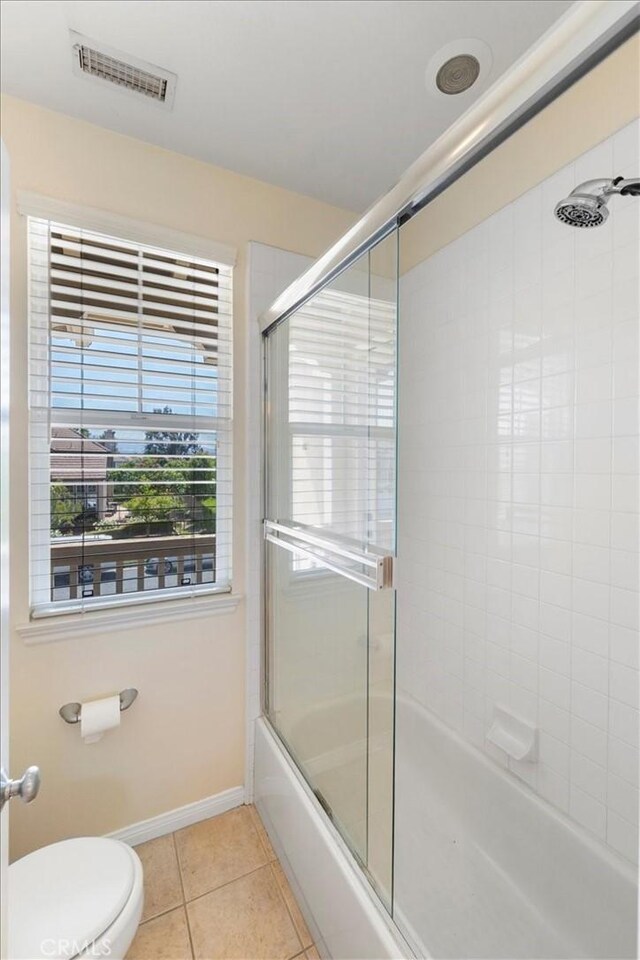 27020 Island Rd, Valencia, CA 91355 - full bathroom featuring bath / shower combo with glass door and tile patterned flooring