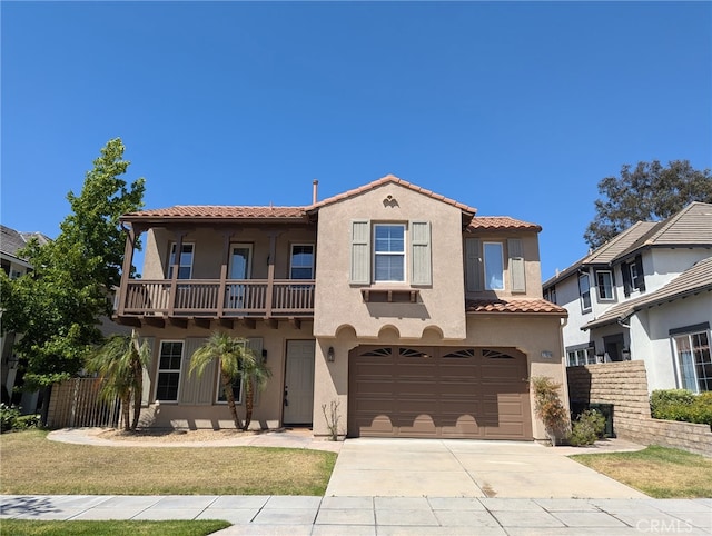27020 Island Rd, Valencia, CA 91355 - mediterranean / spanish-style house featuring a balcony, a garage, stucco siding, concrete driveway, and a tiled roof
