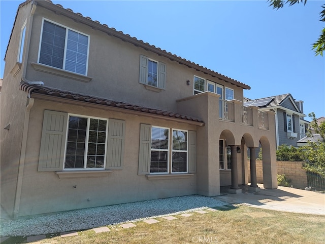 27020 Island Rd, Valencia, CA 91355 - back of house featuring stucco siding, a patio, a balcony, and a tile roof