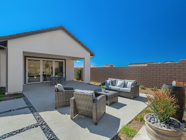 view of patio / terrace with fence and outdoor lounge area
