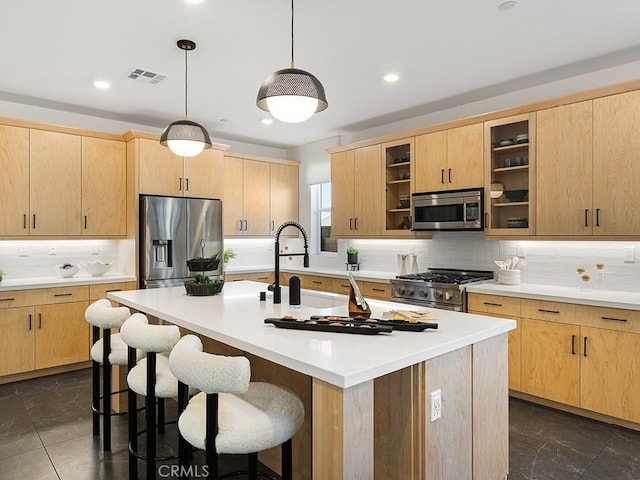 kitchen featuring decorative backsplash, light brown cabinets, and stainless steel appliances