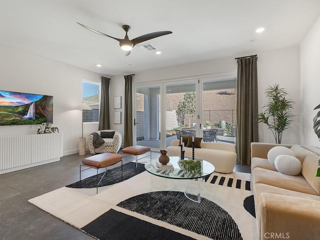 living room featuring recessed lighting, ceiling fan, visible vents, and baseboards