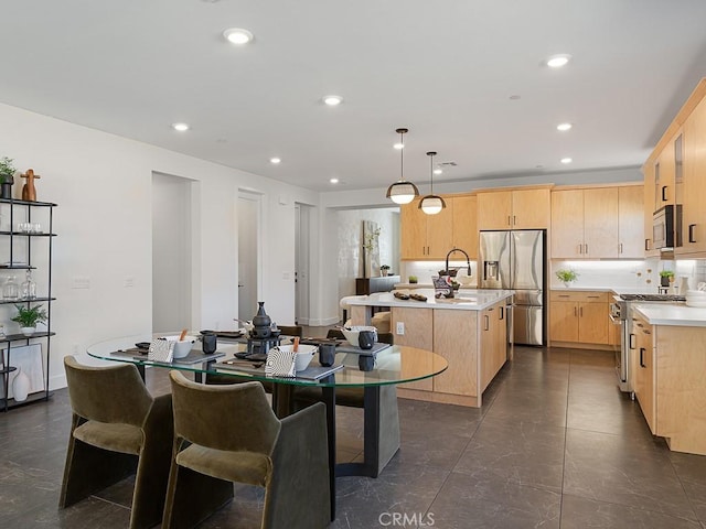 dining room featuring recessed lighting