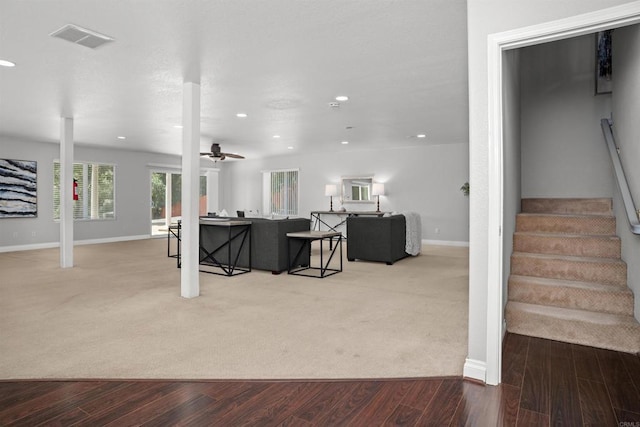 living room featuring visible vents, recessed lighting, stairs, and wood finished floors