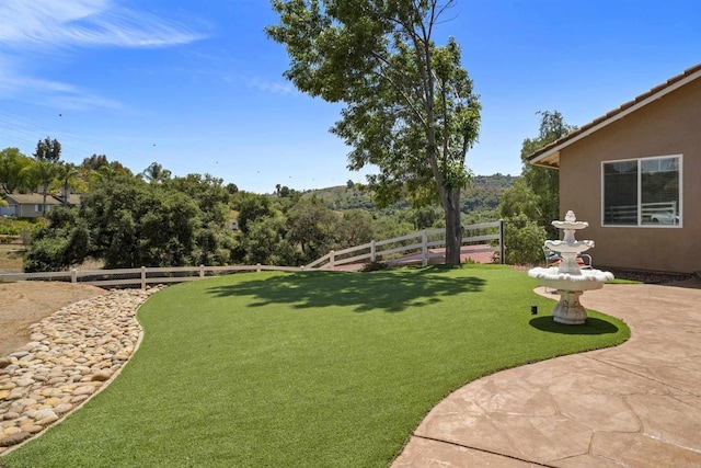 view of yard with a fenced backyard and a patio area