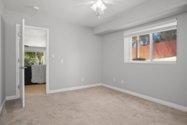 unfurnished bedroom featuring baseboards, a ceiling fan, and carpet flooring