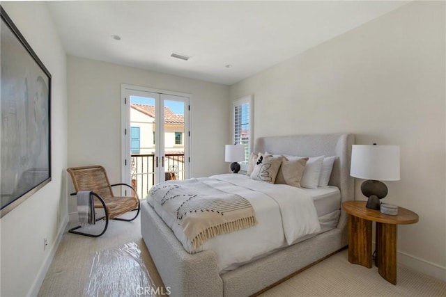 118 Tritone, Irvine, CA 92602 - bedroom with visible vents, baseboards, access to outside, and light carpet