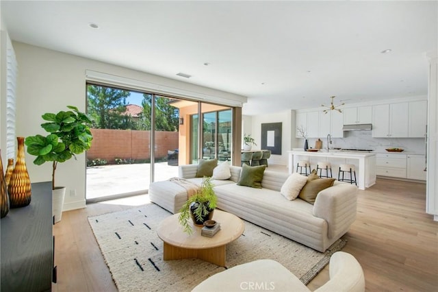 118 Tritone, Irvine, CA 92602 - living area featuring light wood-style flooring, plenty of natural light, and visible vents