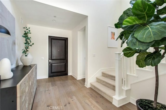 118 Tritone, Irvine, CA 92602 - foyer with baseboards, stairway, and light wood finished floors