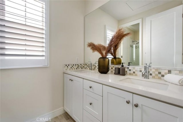 118 Tritone, Irvine, CA 92602 - bathroom featuring backsplash, walk in shower, double vanity, and a sink