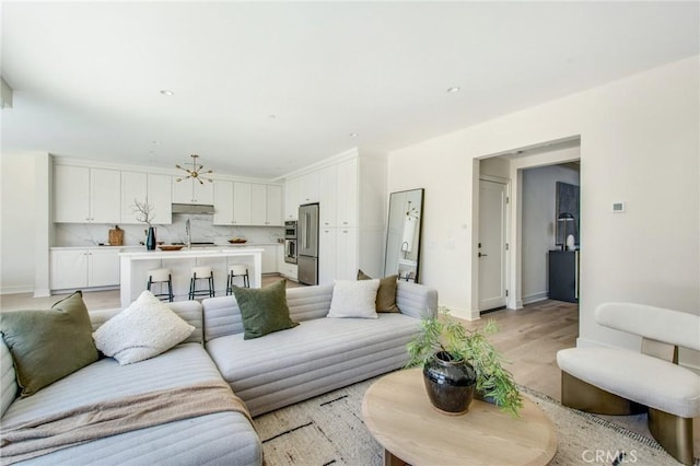 118 Tritone, Irvine, CA 92602 - living room with baseboards and light wood-style floors