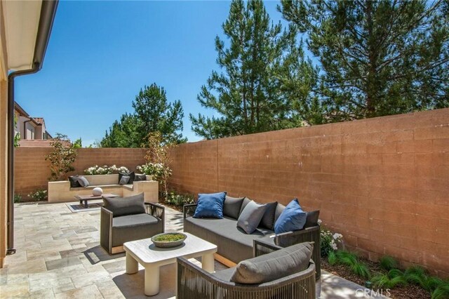 118 Tritone, Irvine, CA 92602 - view of patio featuring an outdoor living space and a fenced backyard