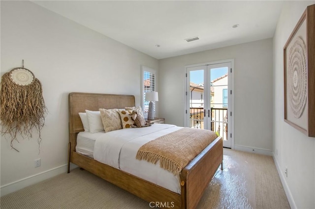 118 Tritone, Irvine, CA 92602 - bedroom featuring baseboards, visible vents, light colored carpet, and access to exterior