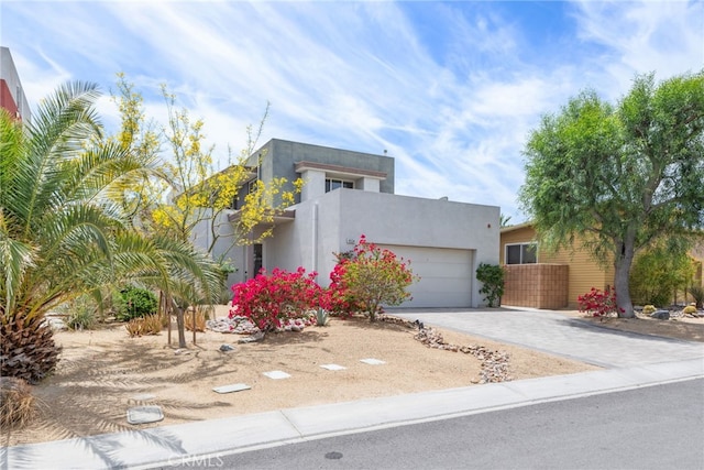 4934 Herzog Way, Palm Springs, CA 92262 - contemporary house featuring driveway, a garage, and stucco siding