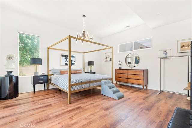 4934 Herzog Way, Palm Springs, CA 92262 - bedroom with wood finished floors and a chandelier