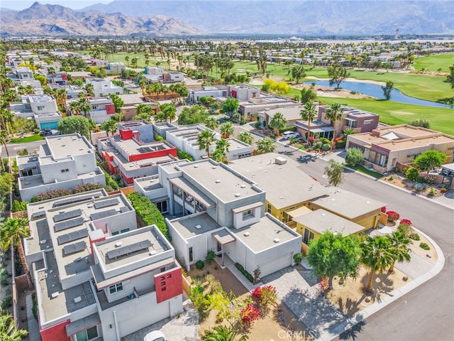 aerial view of residential area featuring a water and mountain view and a golf club