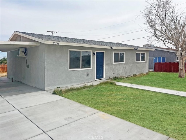 25244 Jade Rd, Barstow, CA 92311 - single story home with roof with shingles, stucco siding, an attached carport, and concrete driveway