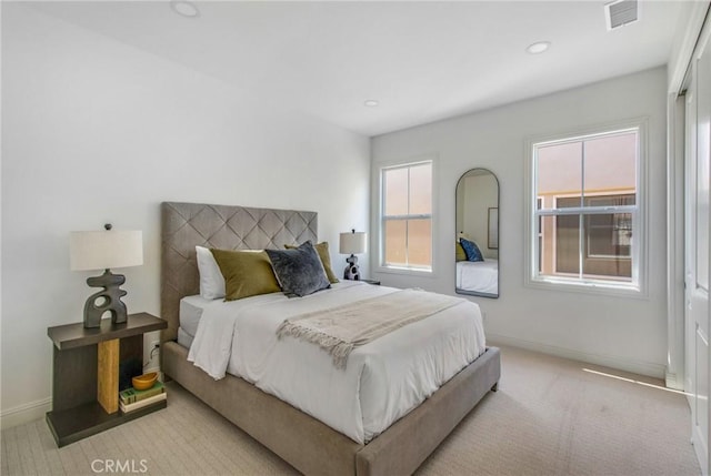 carpeted bedroom featuring visible vents, recessed lighting, and baseboards
