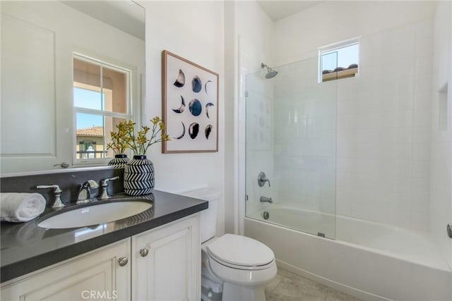 bathroom featuring vanity, bathtub / shower combination, and toilet