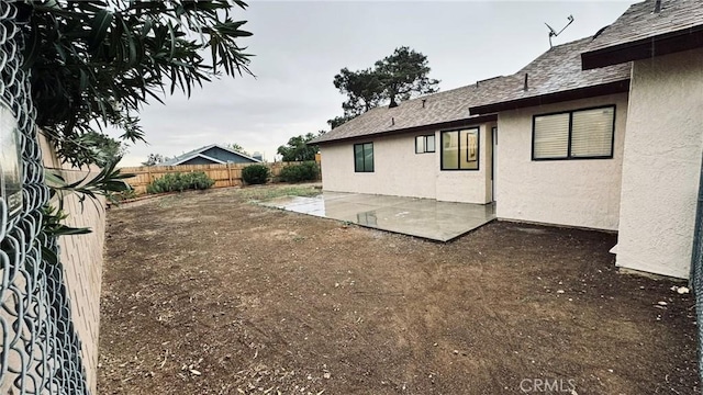 view of yard featuring a fenced backyard and a patio area